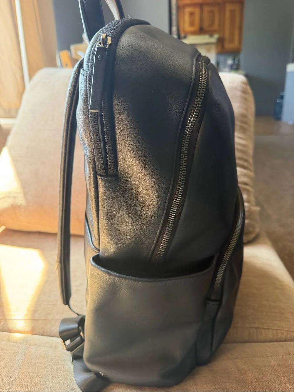 Tumi Black Leather Men's Backpack with Front Zip Pocket
